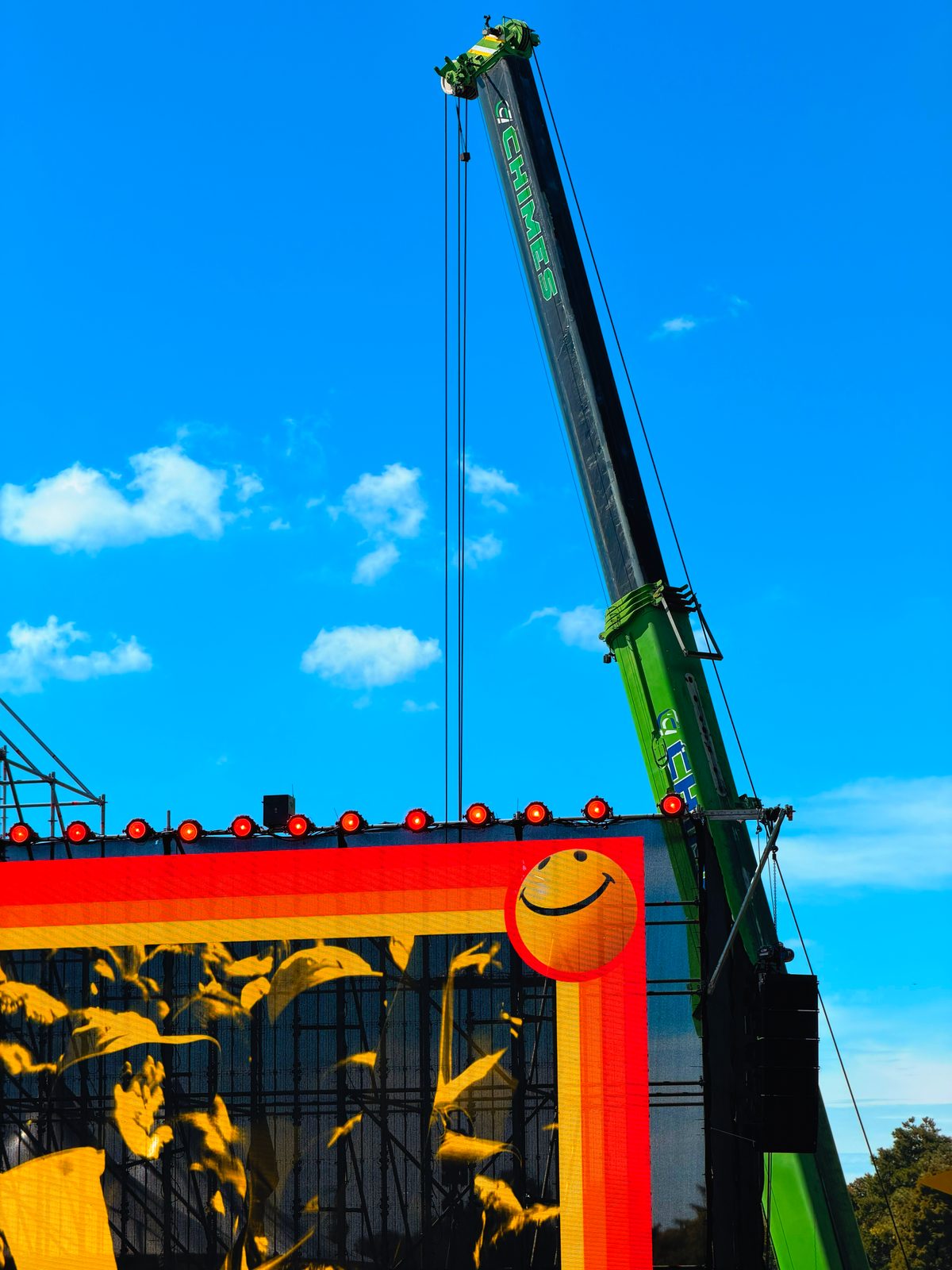 Crane performing a mast and tower lift for a telecoms site